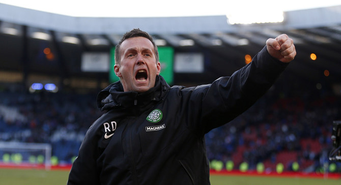 Celtic manager Ronny Deila celebrates winning their Scottish League Cup semi final soccer match against Rangers at Hampden Park stadium in Glasgow